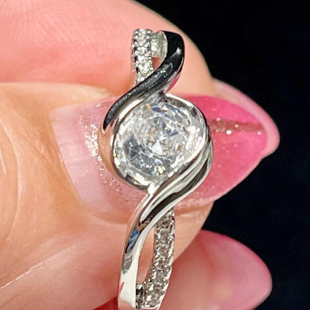 Elegant Silver Swirl Diamond Ring